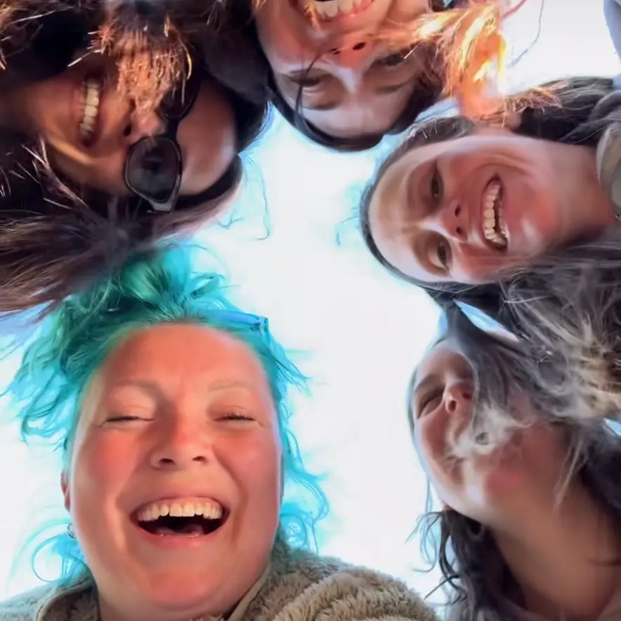 Group of friends laughing together at the cottage