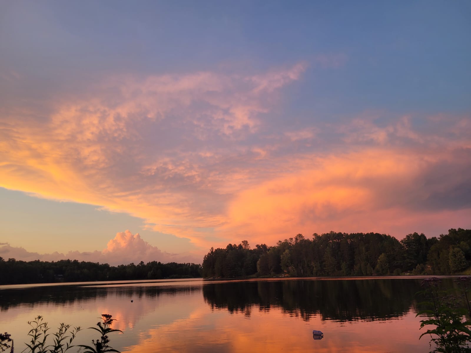 Golden sunset over a calm Canadian lake